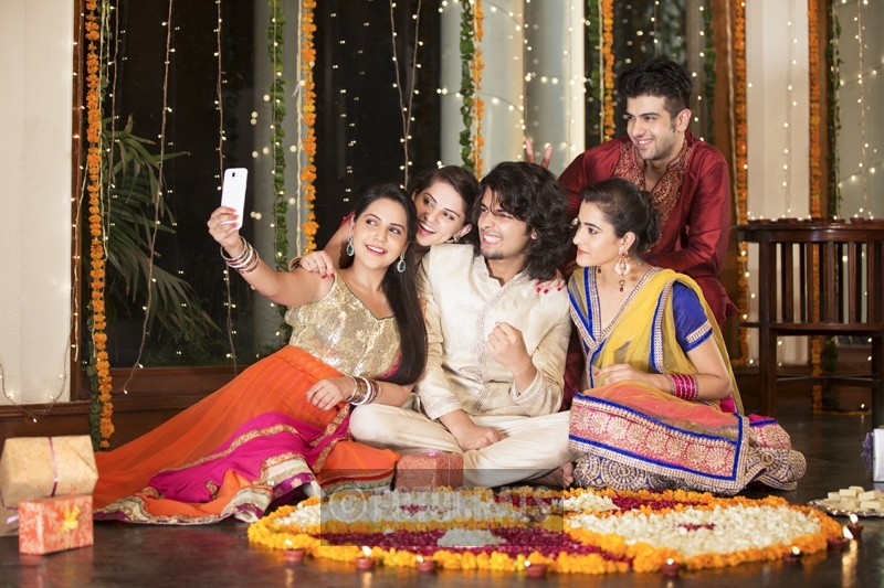 group of friends clicking selfie during diwali festival