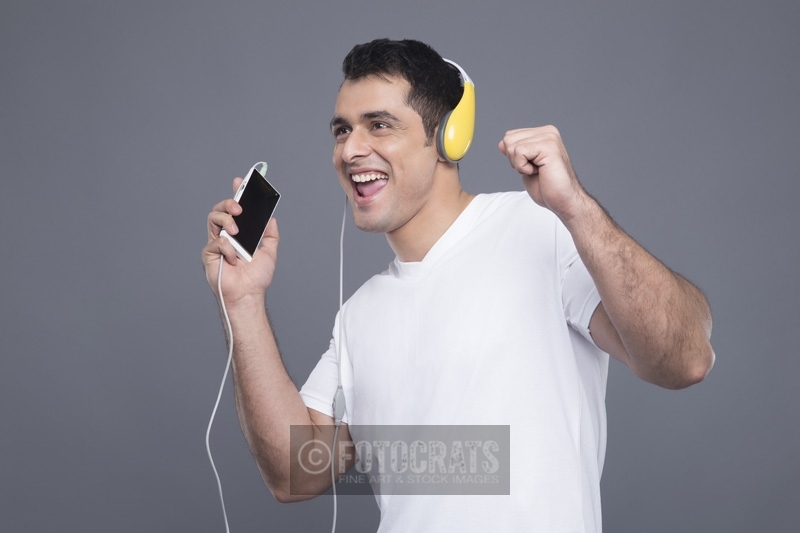 man listening to music on phone