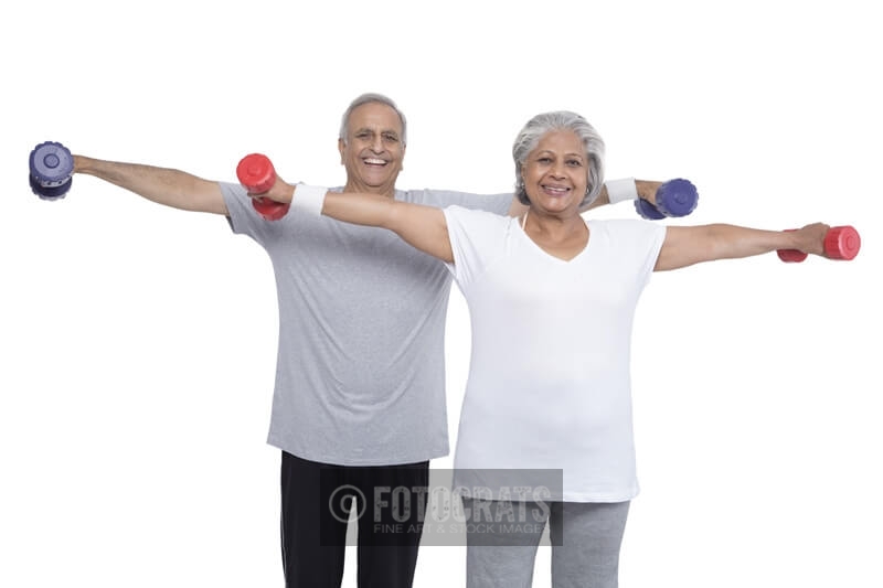 old couple exercising with dumbbells