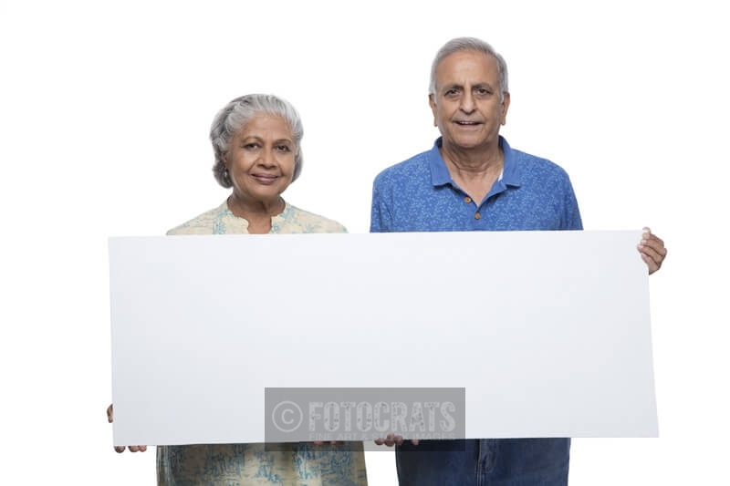 old couple with message board 