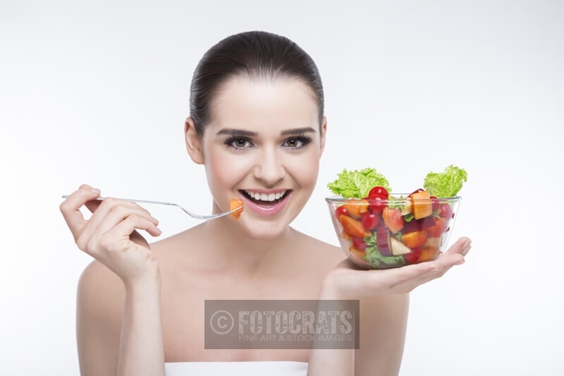 beautiful girl eating salad