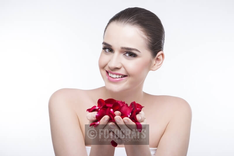 beautiful girl with rose petals 