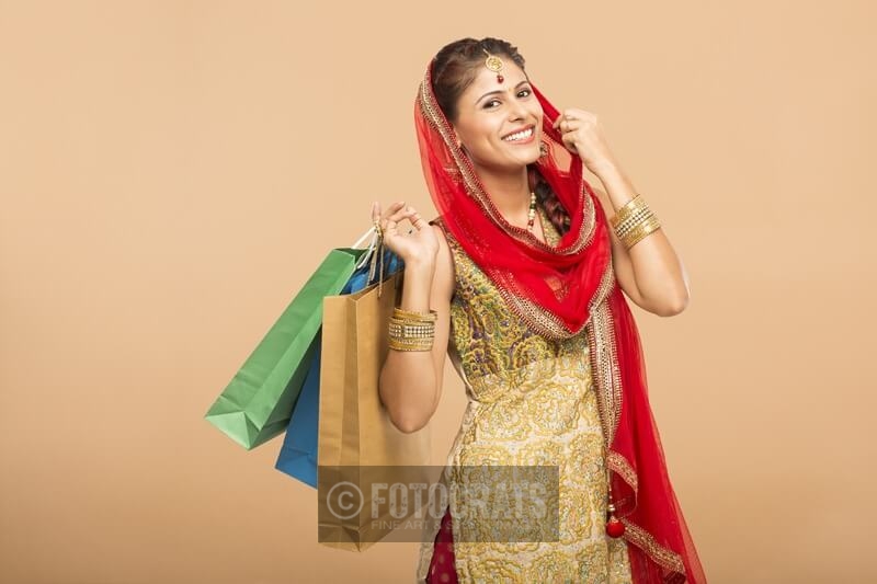 woman posing with shopping bags 