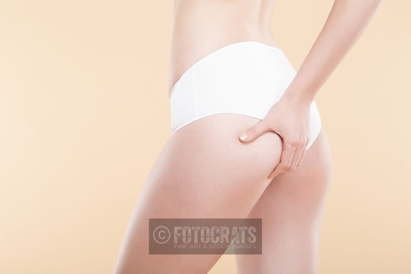 girl checking cellulite on her butt
