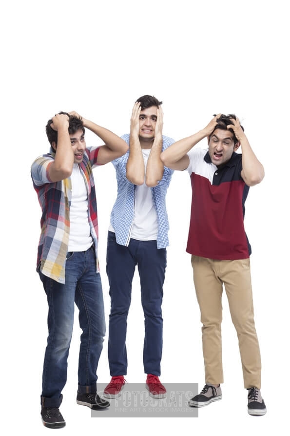 three boys grabbing their head