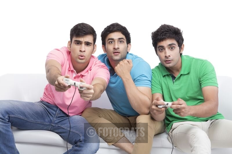 friends playing video game a home 