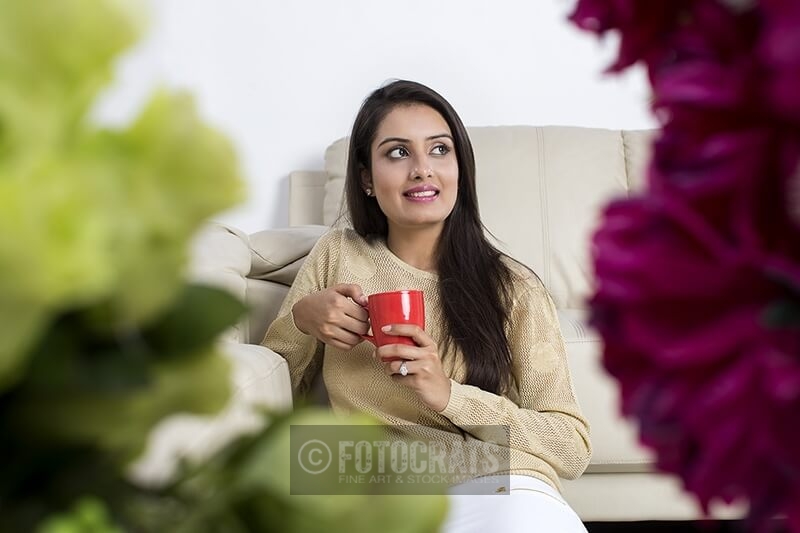 woman sitting at home with coffee mug