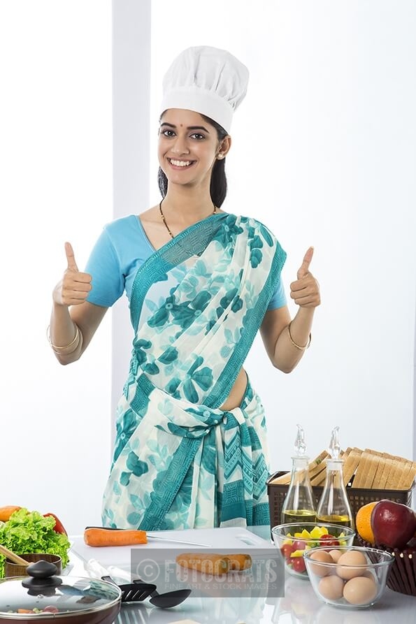 indian housewife showing thumbs up