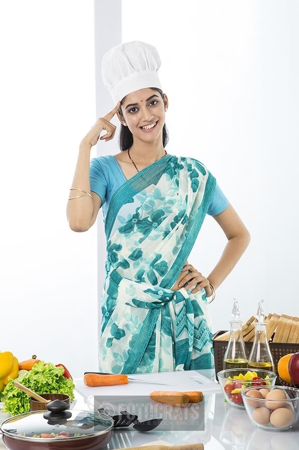 indian housewife pointing at her brain