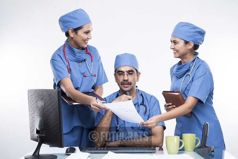 Medical team talking with doctor