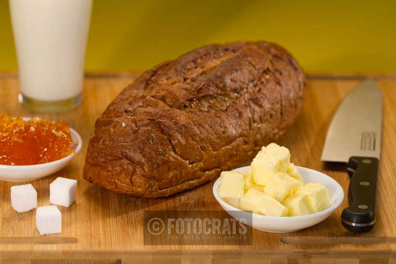 fresh brown bread with butter and jelly
