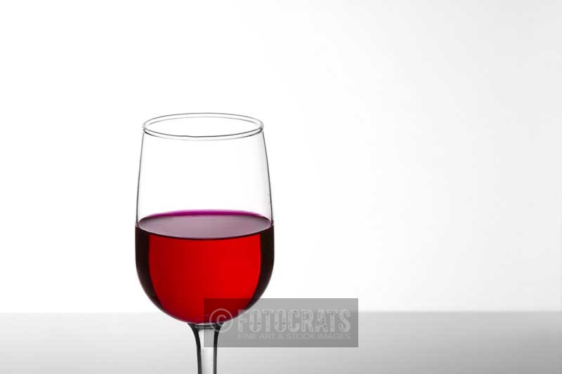 glass of red wine with white background 