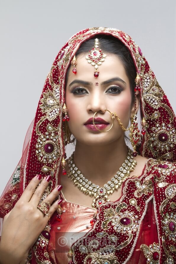 beautiful indian bride looking into the camera 