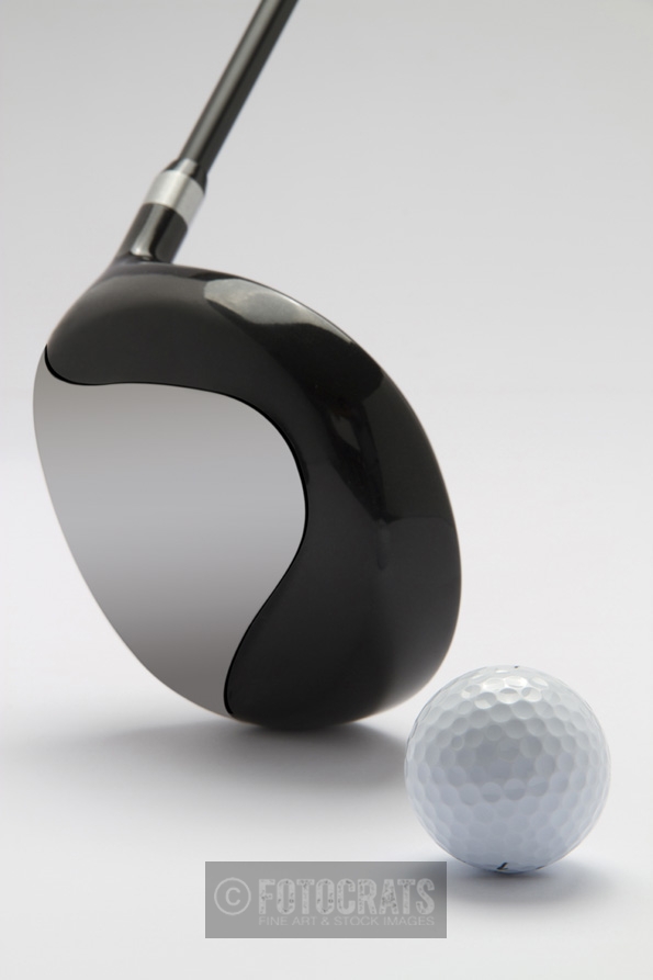 close up of golf club with golf ball