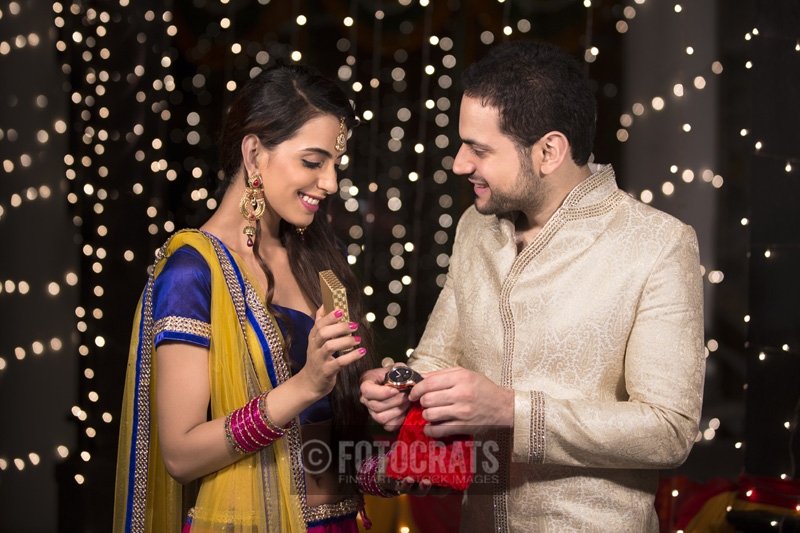 woman gifting husband a watch on diwali