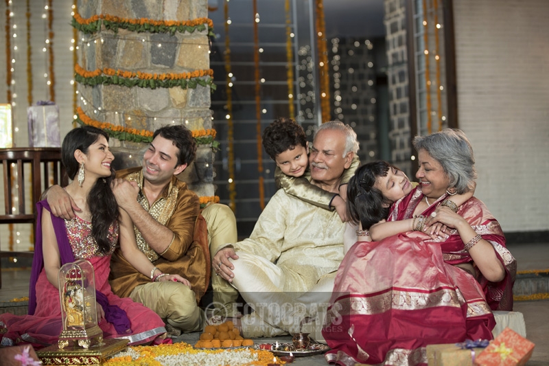  family celebrating diwali together 