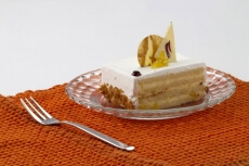 close up shot of a cream cake lying on the table