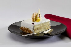a slice of white chocolate cake served on table 