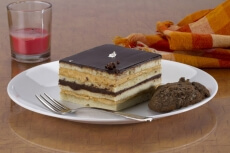 chocolate pastry served with cookies on table 