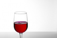 a glass of red wine with copy space for advertising purposes