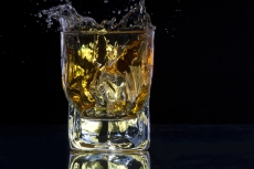 whiskey splashing from a glass of whiskey