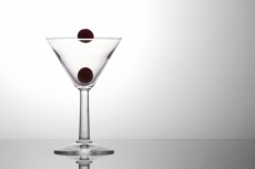 fresh grapes in a cocktail glass isolated on a white background