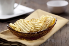grilled potato chips on a glass bowl