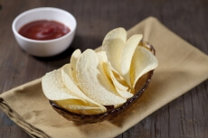 plain potato chips with ketchup