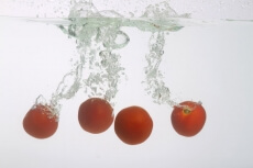 tomatoes splashed in water