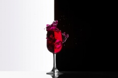 red wine glass against black and white background