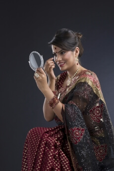 woman in dressed in indian wear getting ready