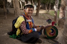 boy with ladakhi ceremonial drums