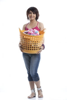 housewife standing with a laundry basket