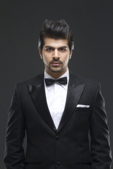 well dressed male model in a black suit