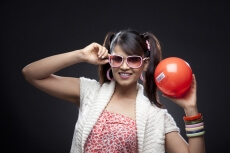stylish woman posing with red ball with barcode