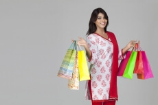 girl with shopping bags posing with copy space for advertising purpose