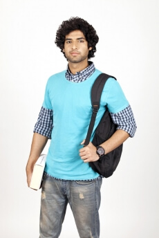 college boy carrying bag and holding book