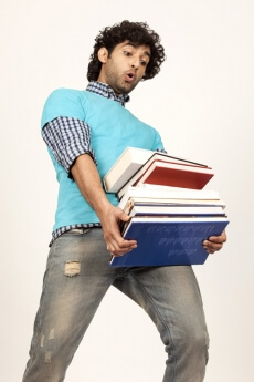 college boy carrying books