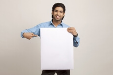man displaying board while posing
