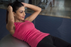 sports girl doing exercise for the abdominal