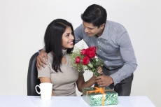 husband wishing wife with flowers