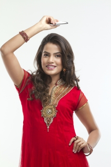 woman in ethnic wear with mobile phone