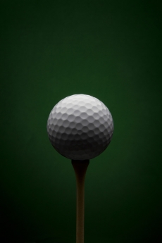 Golf ball with dark green background