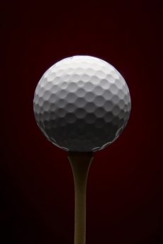 Golf ball with red background