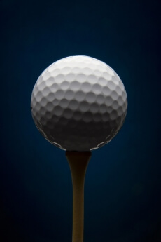 Golf ball with violet background
