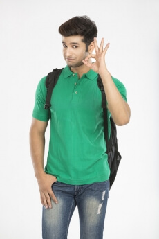 young college boy posing while gesturing for the camera 