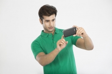 man clicking picture from mobile phone 