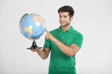 man pointing at the globe