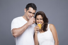 couple drinking orange juice 