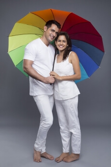 couple posing with an umbrella 